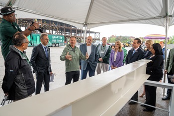MSU President speaking at spartan bus tour stop